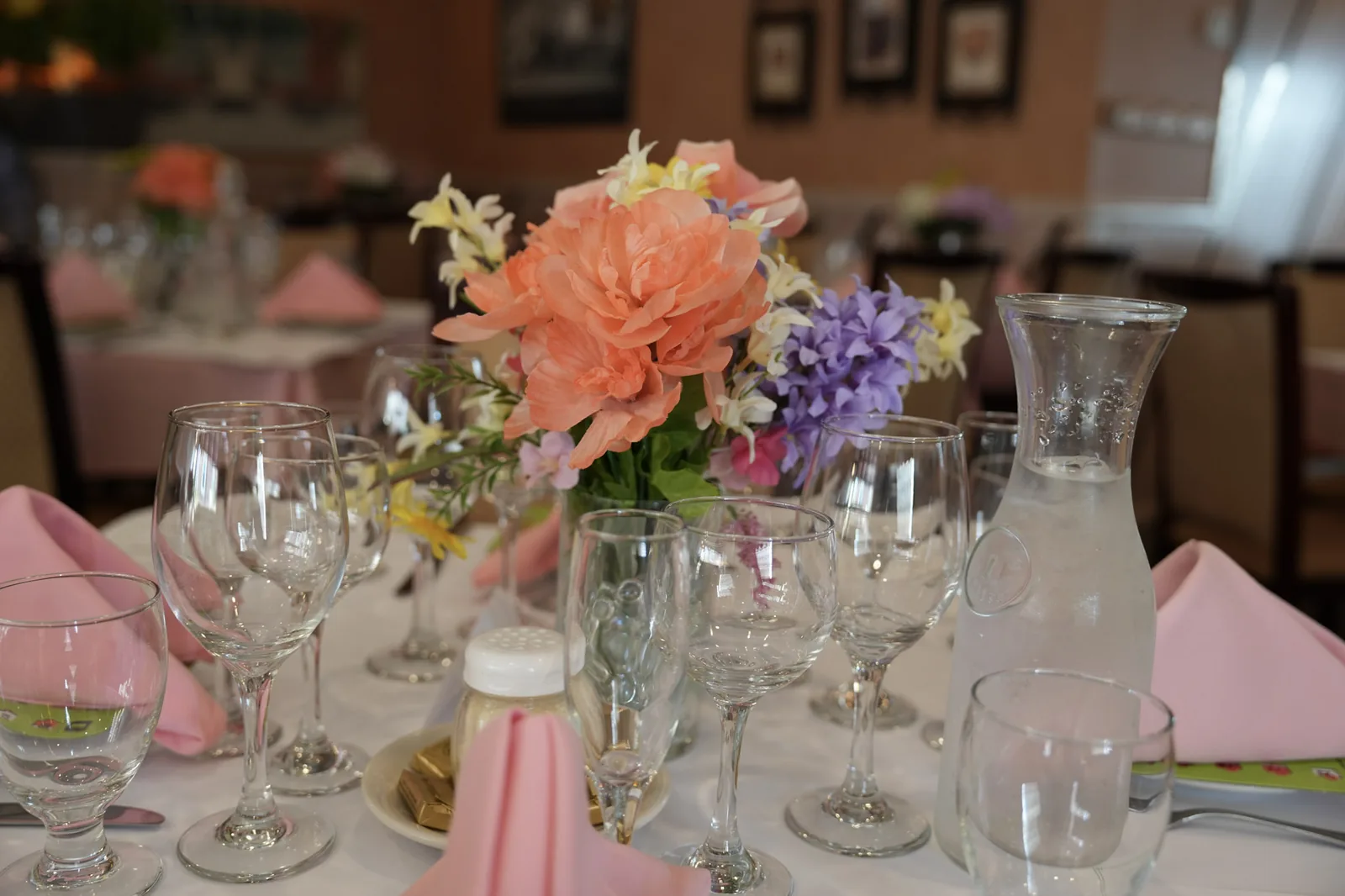 Table set with a fresh flower centerpiece for a catered event at Ciminelli's in Bethpage